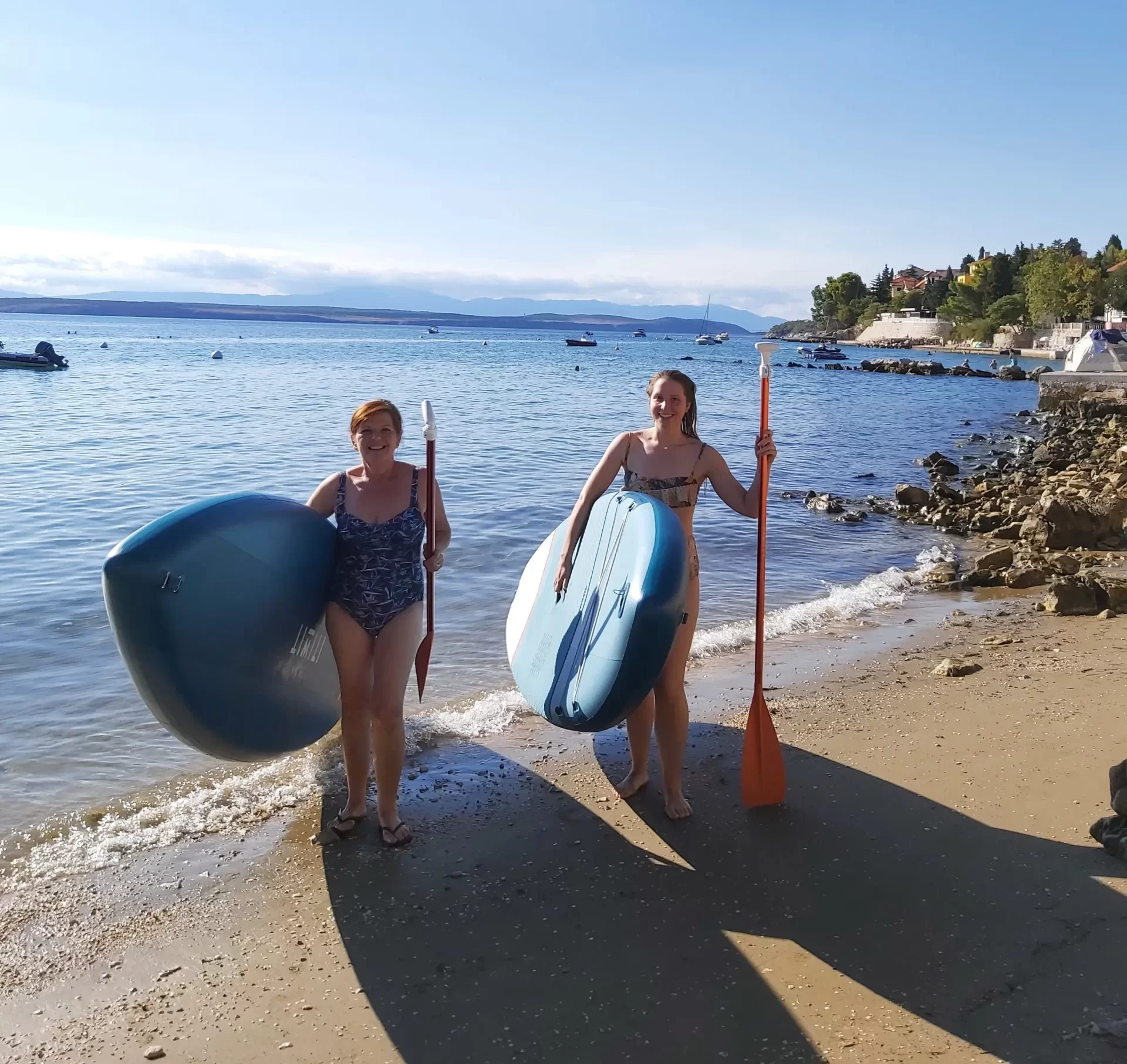 This picture shows two people having best time on our sup rent!