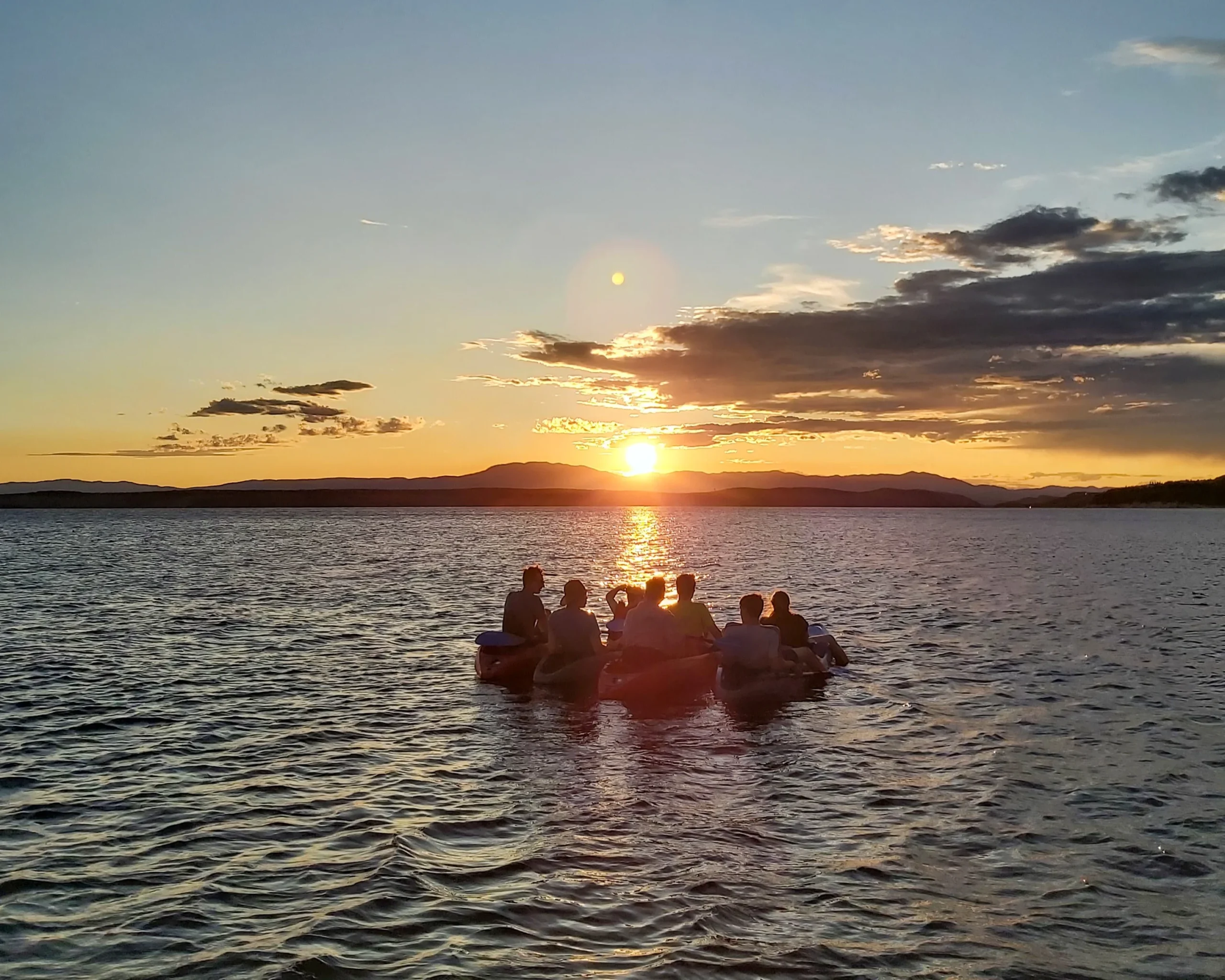Group of people on sunset kayak tour